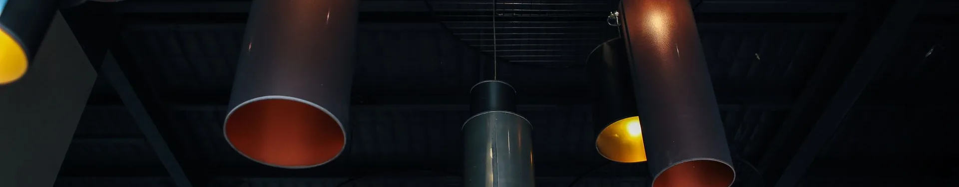 Pendant lighting beneath an industrial ceiling