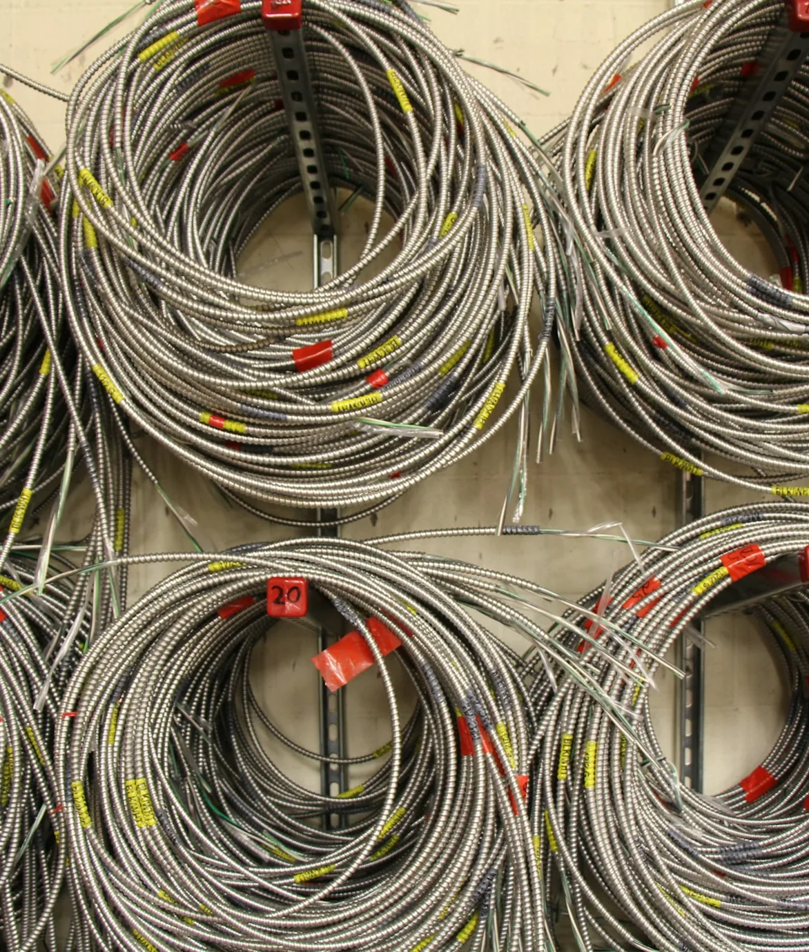 Coils of prepared metal-clad electrical cable