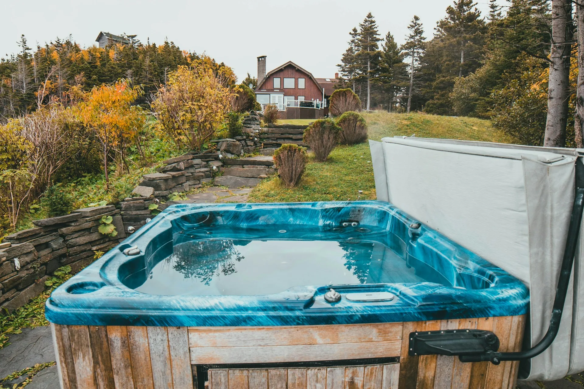 Outdoor hot tub on a stone patio