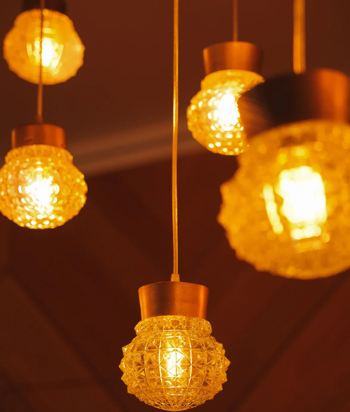 Decorative glass pendant lights glowing warmly