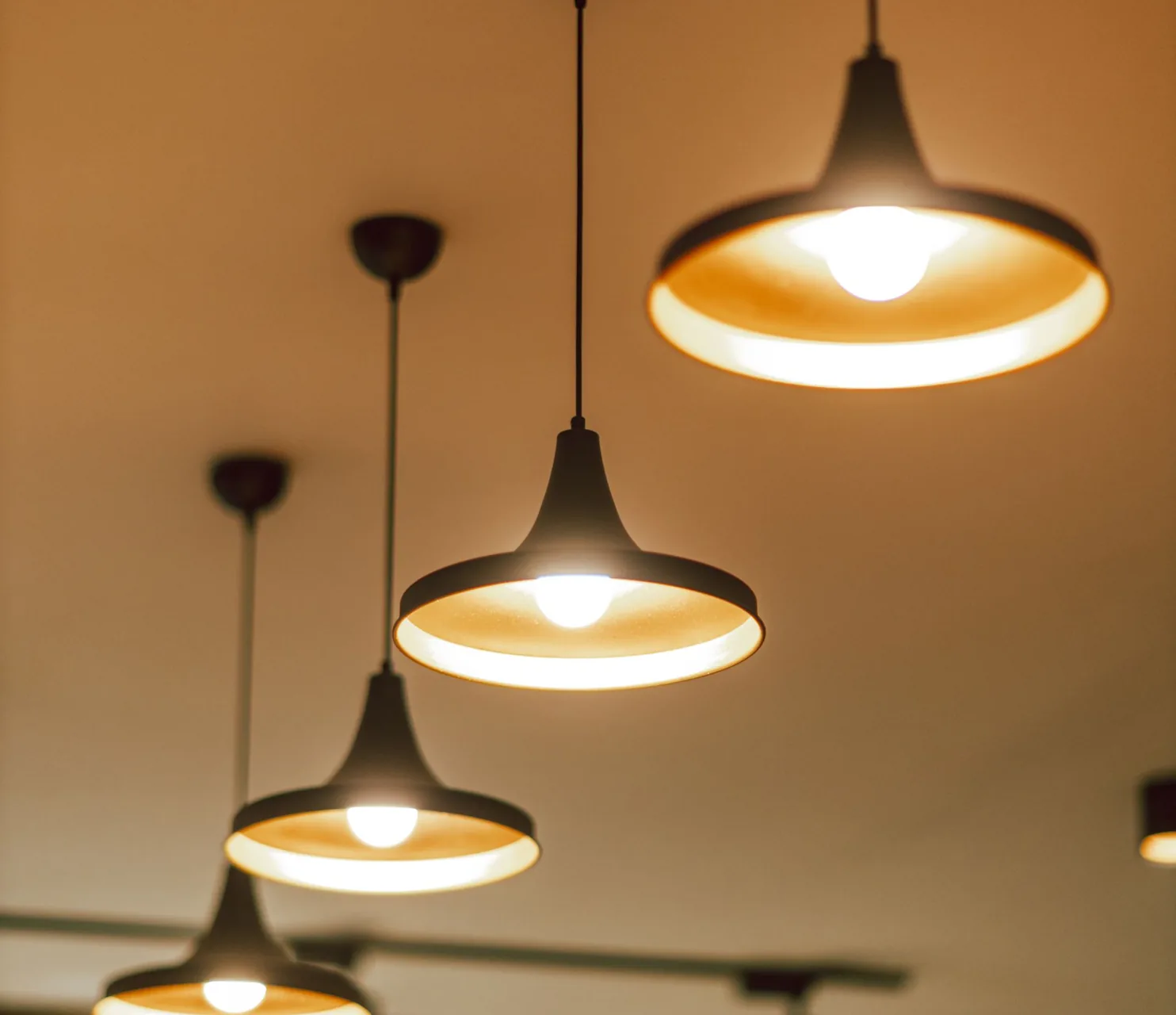 A row of illuminated pendant lights